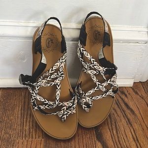 Chaco sandals barely worn with black and white patterned straps and a brown base